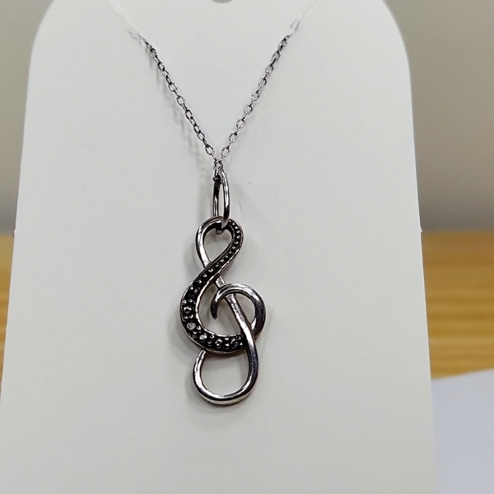 Silver tone charm necklace